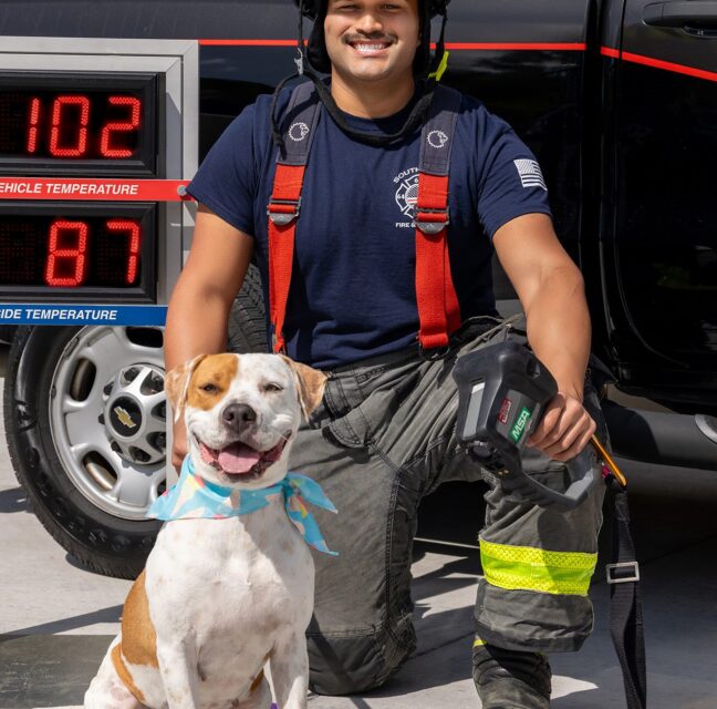 Poppy shows off the new Gulf Coast Humane Society Fireman’s Calendar