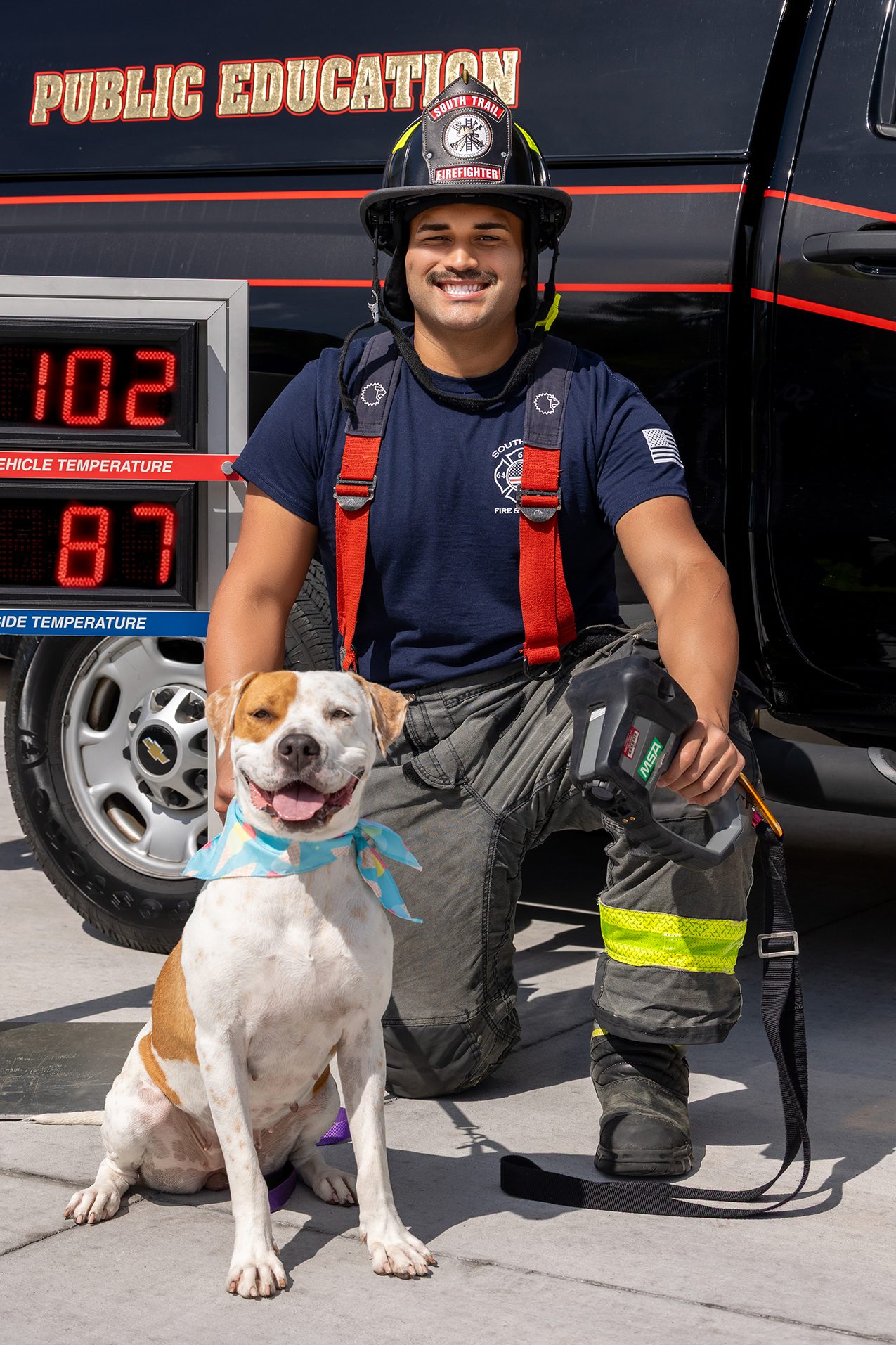 Poppy shows off the new Gulf Coast Humane Society Fireman’s Calendar