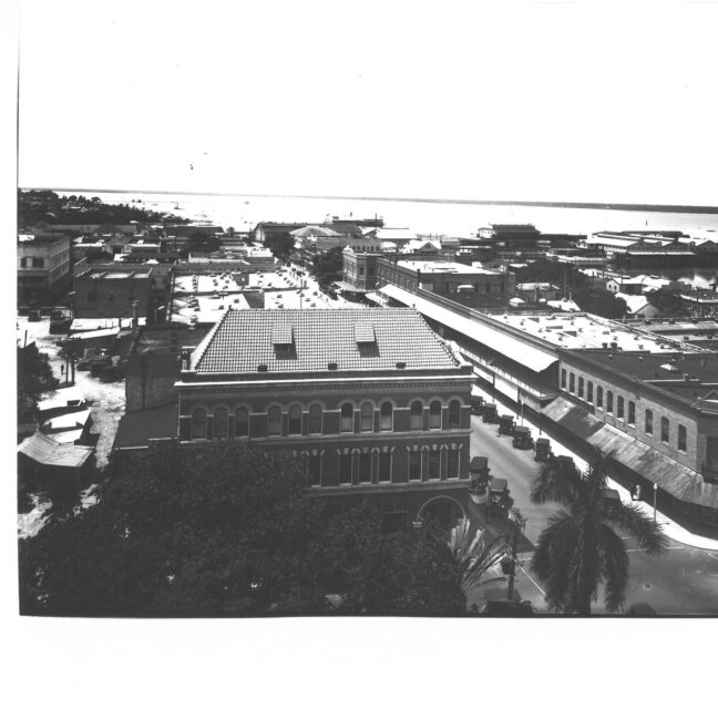 Elevated view over a downtown Fort Myers block toward the riverfront