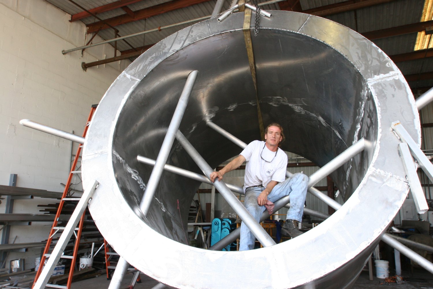 Artist James DiGiorgio inside his You Are Here sculpture, 2006