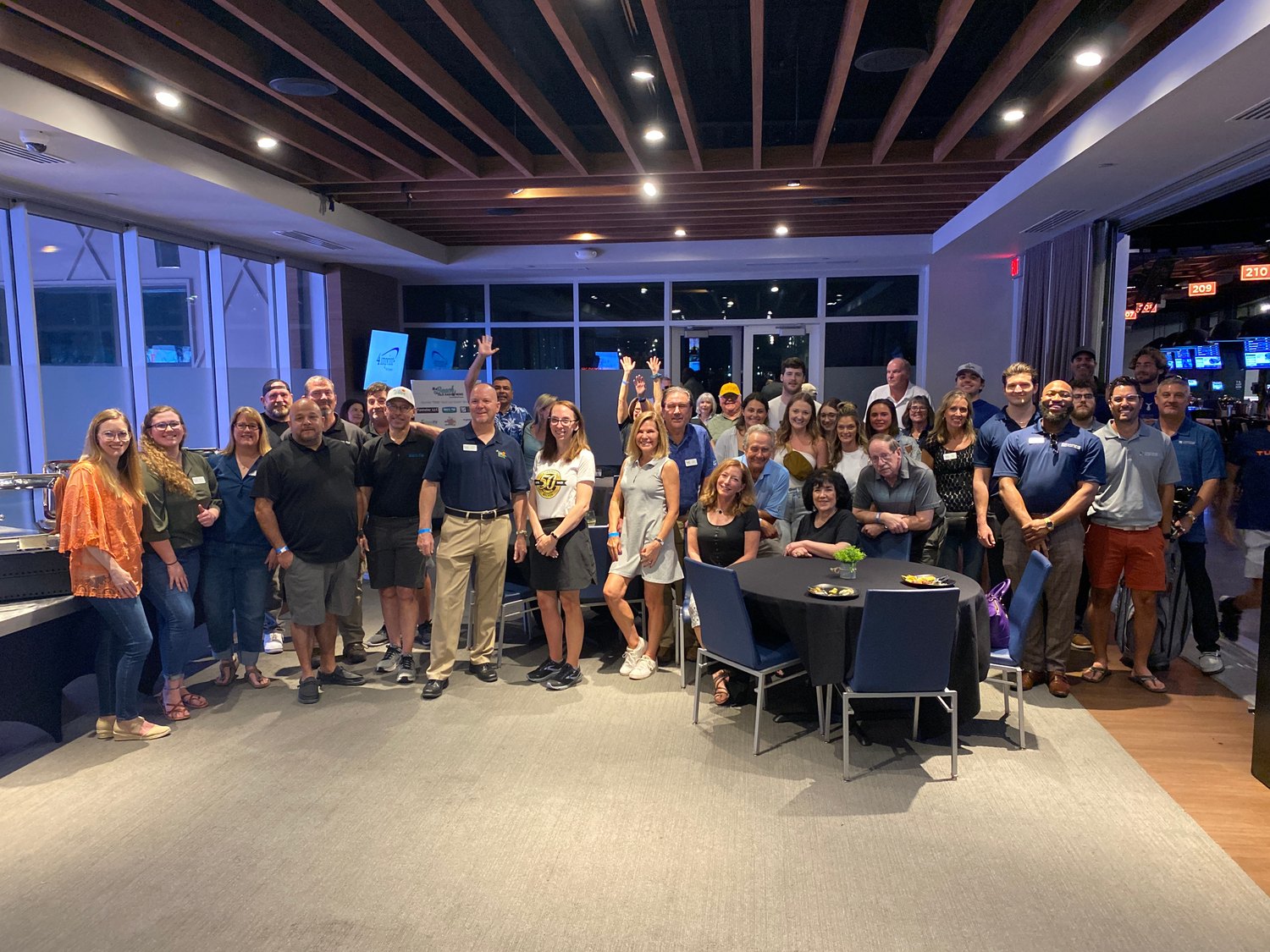 Large group of KLCB supporters gathered for a photo at Topgolf